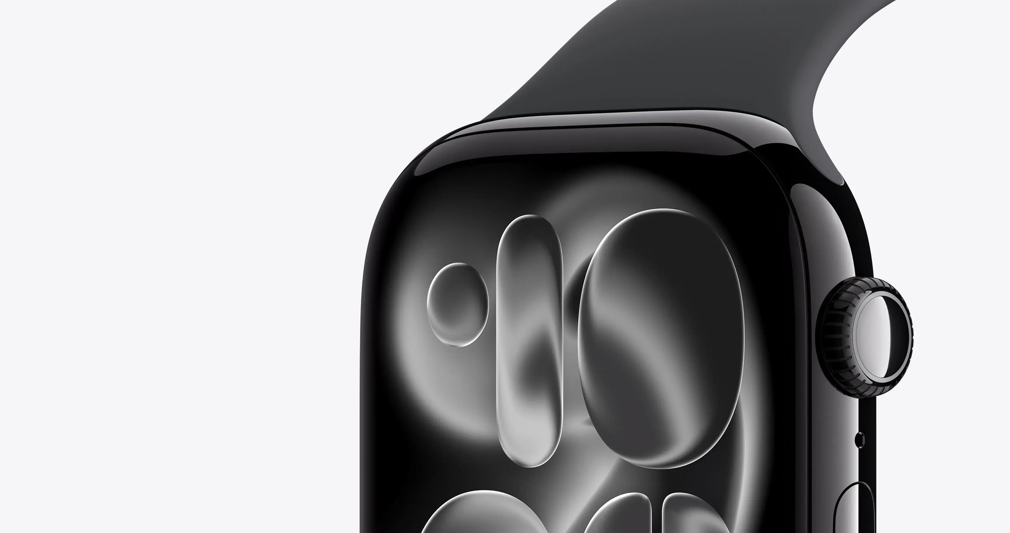 Макро-фото чорного Apple Watch: деталізований вигляд глянцевого корпусу, закругленого дисплея та коліщатка Digital Crown