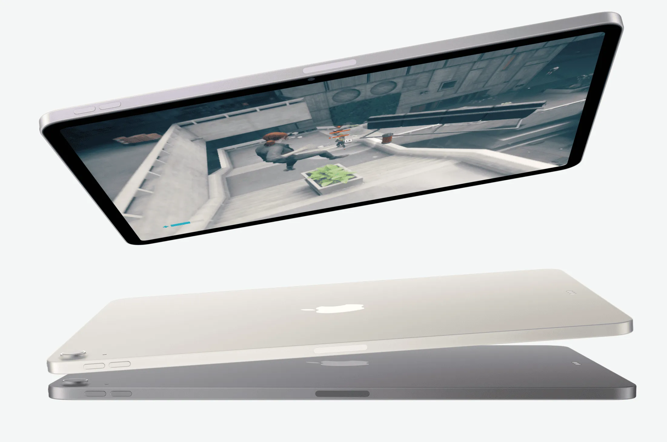 iPad Air в альбомній орієнтації та з відеогрою, дві інші моделі iPad Air нижче