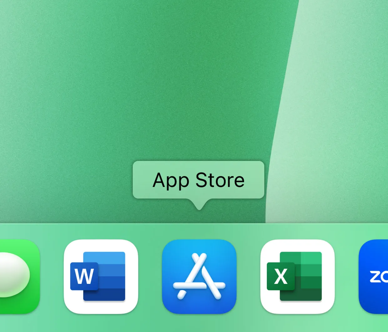 На дисплеї iMac показано панель Dock зі значками додатків: Контакти, Microsoft Word, App Store, Microsoft Excel та Zoom