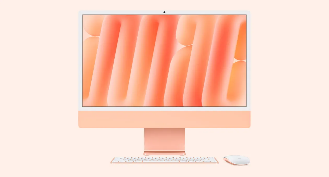 Помаранчевий iMac з мишею та клавіатурою в тон, вид спереду