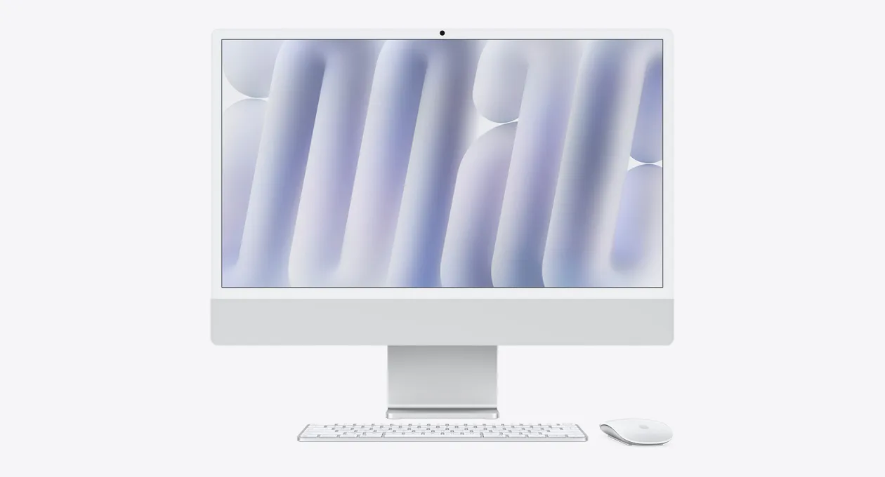 Сріблястий iMac з мишею та клавіатурою в тон, вид спереду