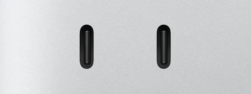 Два порти USB-C на передній панелі Mac mini показано великим планом.